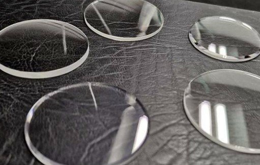 A sapphire window being tested with a sharp metal point, showing no scratches